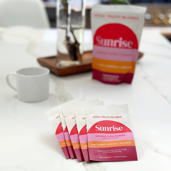 VYB Sunrise Super Powder travel packs with coffee mug — convenient morning wellness routine supplement